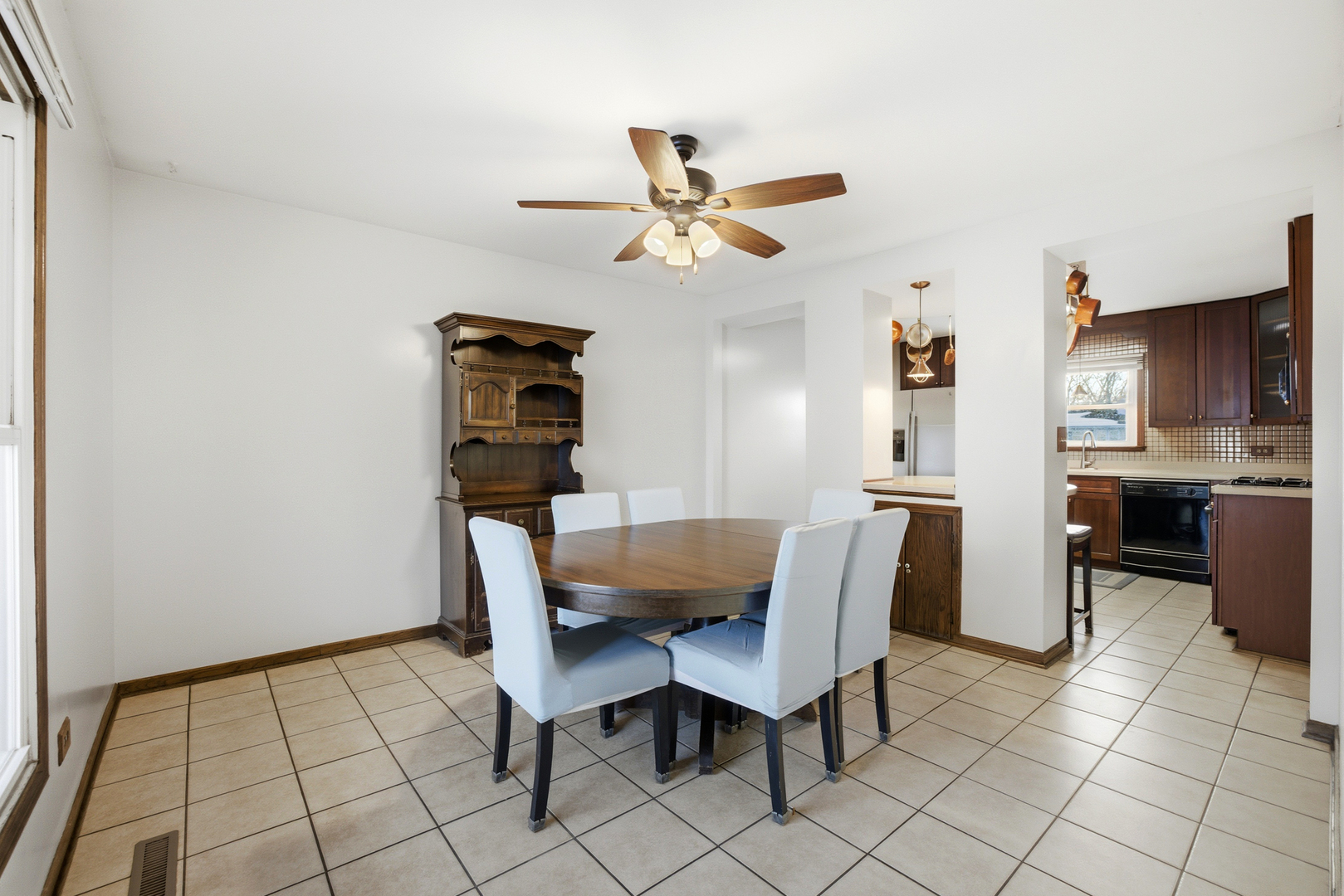 220 Dato Drive Streamwood, IL 60107 - Photo 14 of 36 a dining room with furniture and wooden floor