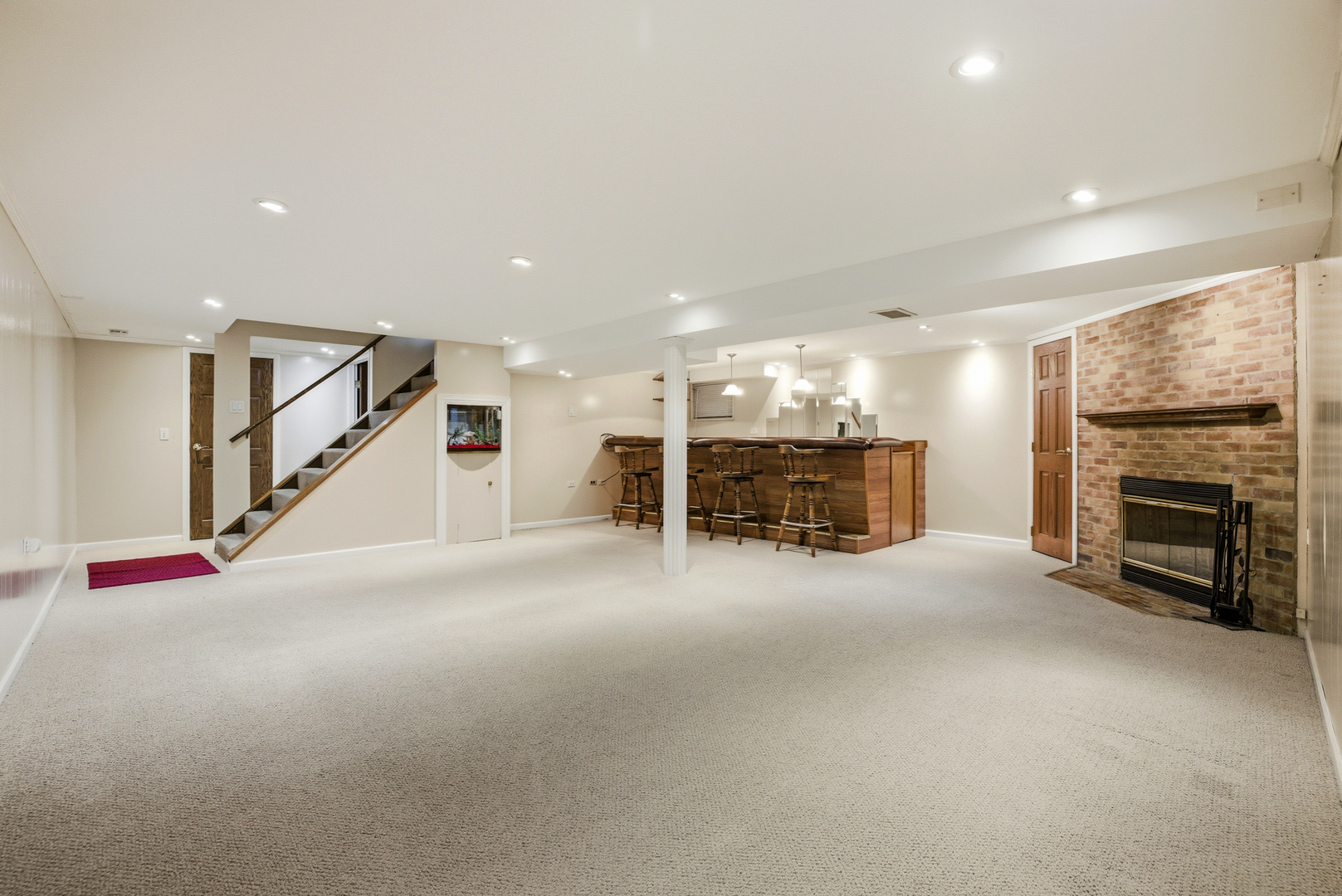 220 Dato Drive Streamwood, IL 60107 - Photo 16 of 36 a view of an empty room with fireplace and stairs