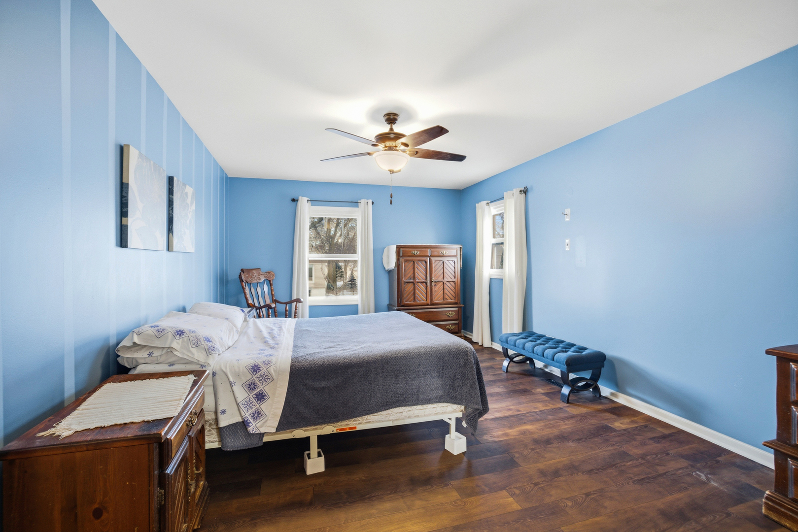 220 Dato Drive Streamwood, IL 60107 - Photo 20 of 36 a bedroom with a bed and a chandelier