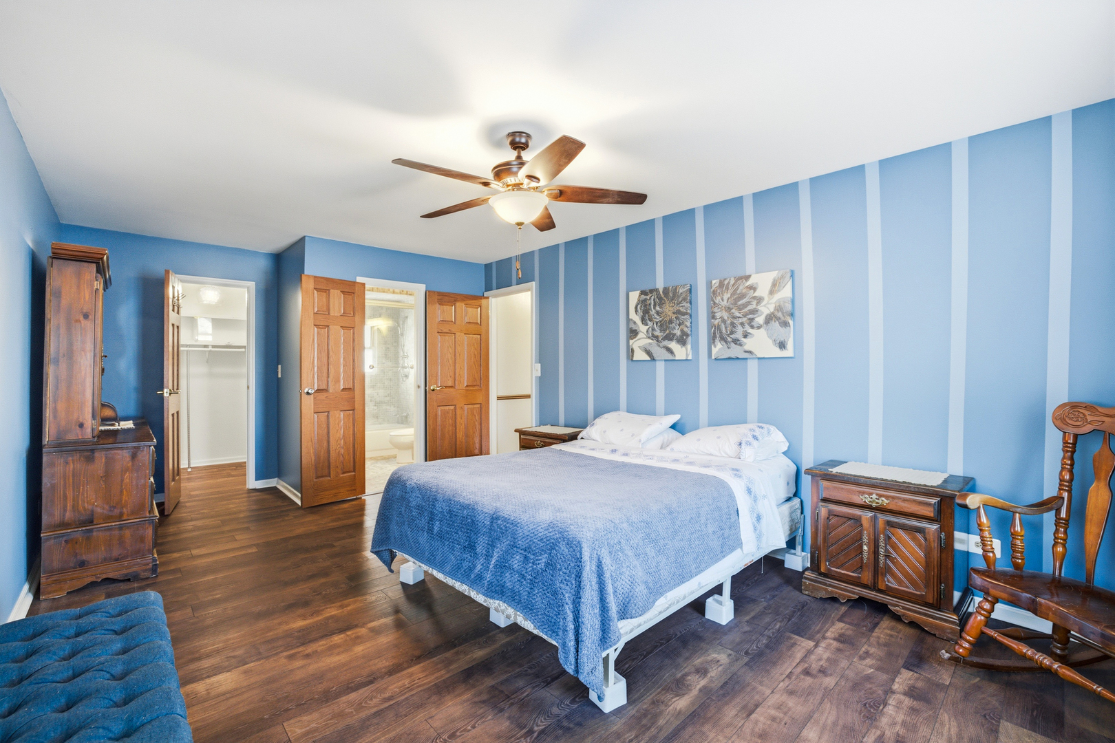 220 Dato Drive Streamwood, IL 60107 - Photo 21 of 36 a bedroom with a bed and a chandelier