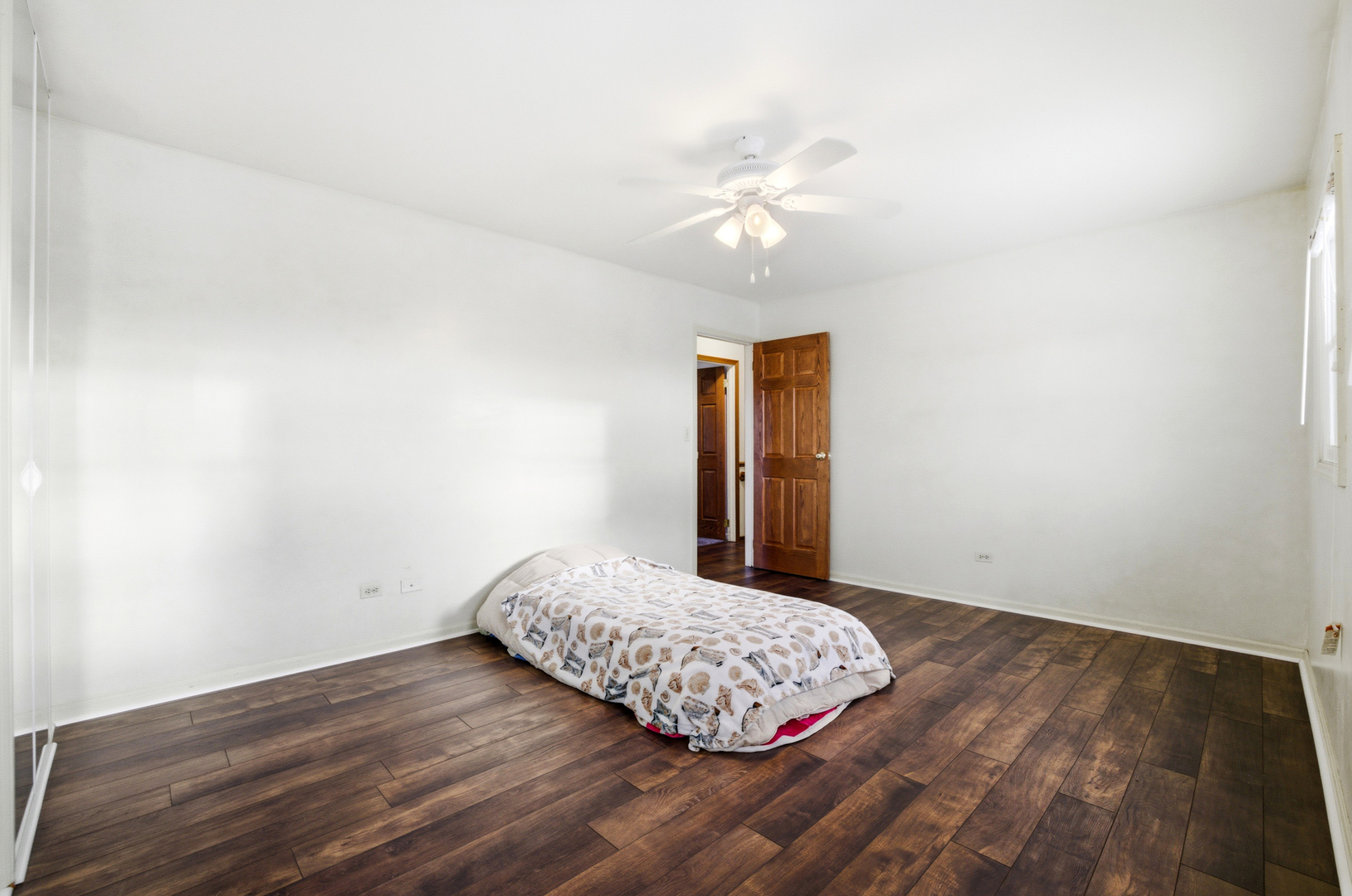 220 Dato Drive Streamwood, IL 60107 - Photo 28 of 36 a bedroom with a bed and a chandelier