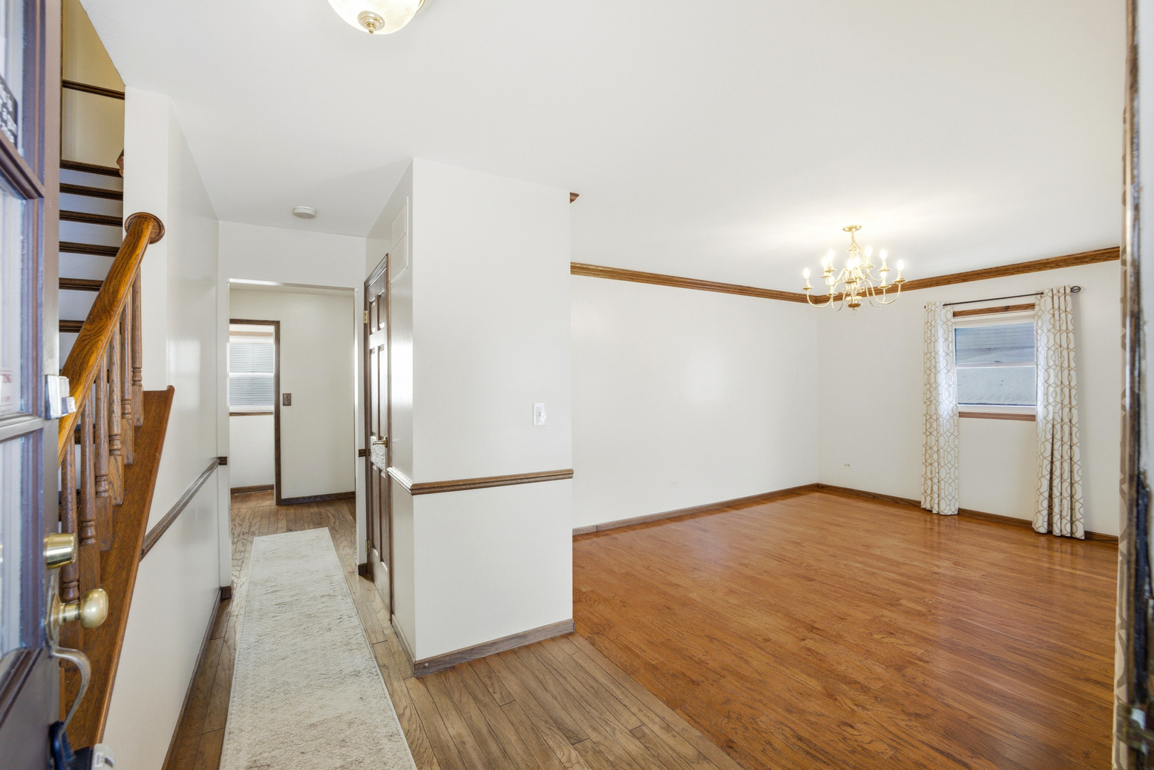 220 Dato Drive Streamwood, IL 60107 - Photo 3 of 36 a view of livingroom with hardwood floor and hallway