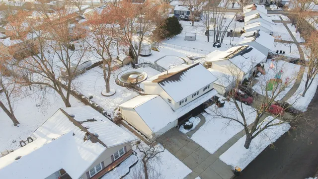 a view of a house with yard and sitting area
