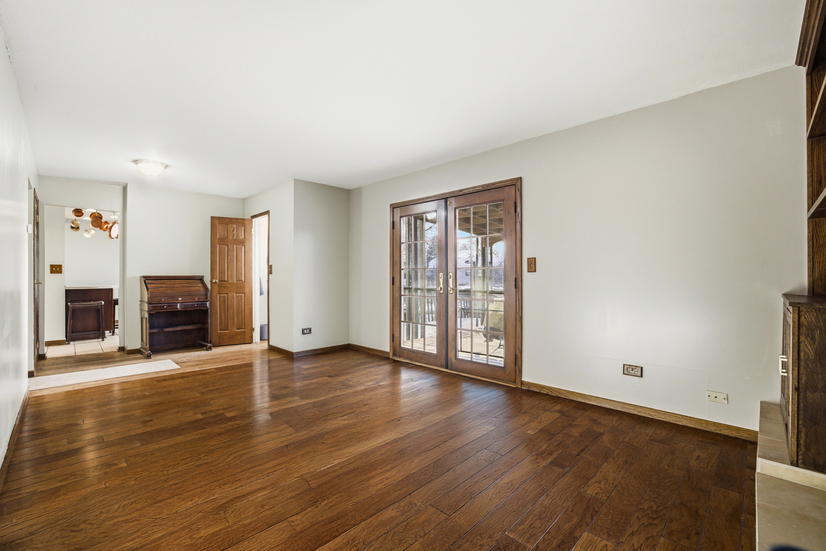220 Dato Drive Streamwood, IL 60107 - Photo 7 of 36 an empty room with wooden floor and a fireplace