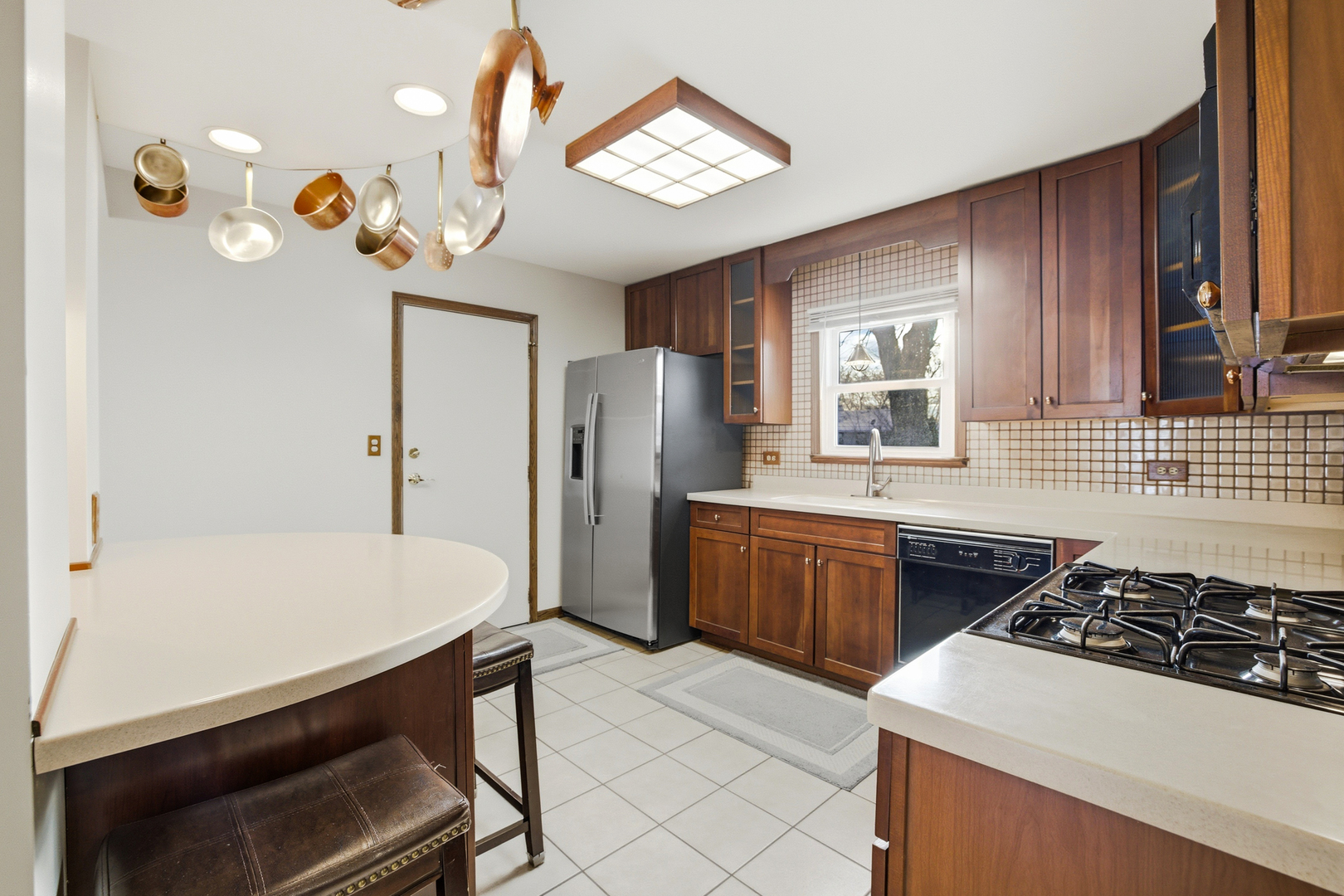 220 Dato Drive Streamwood, IL 60107 - Photo 10 of 36 a kitchen with a refrigerator and a sink
