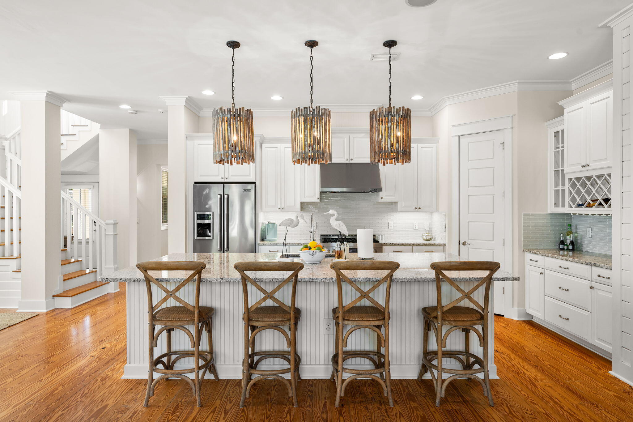 384 East Royal Fern Way Santa Rosa Beach, FL 32459 - Photo 23 of 63 a view of a dining room with furniture wooden floor and a chandelier