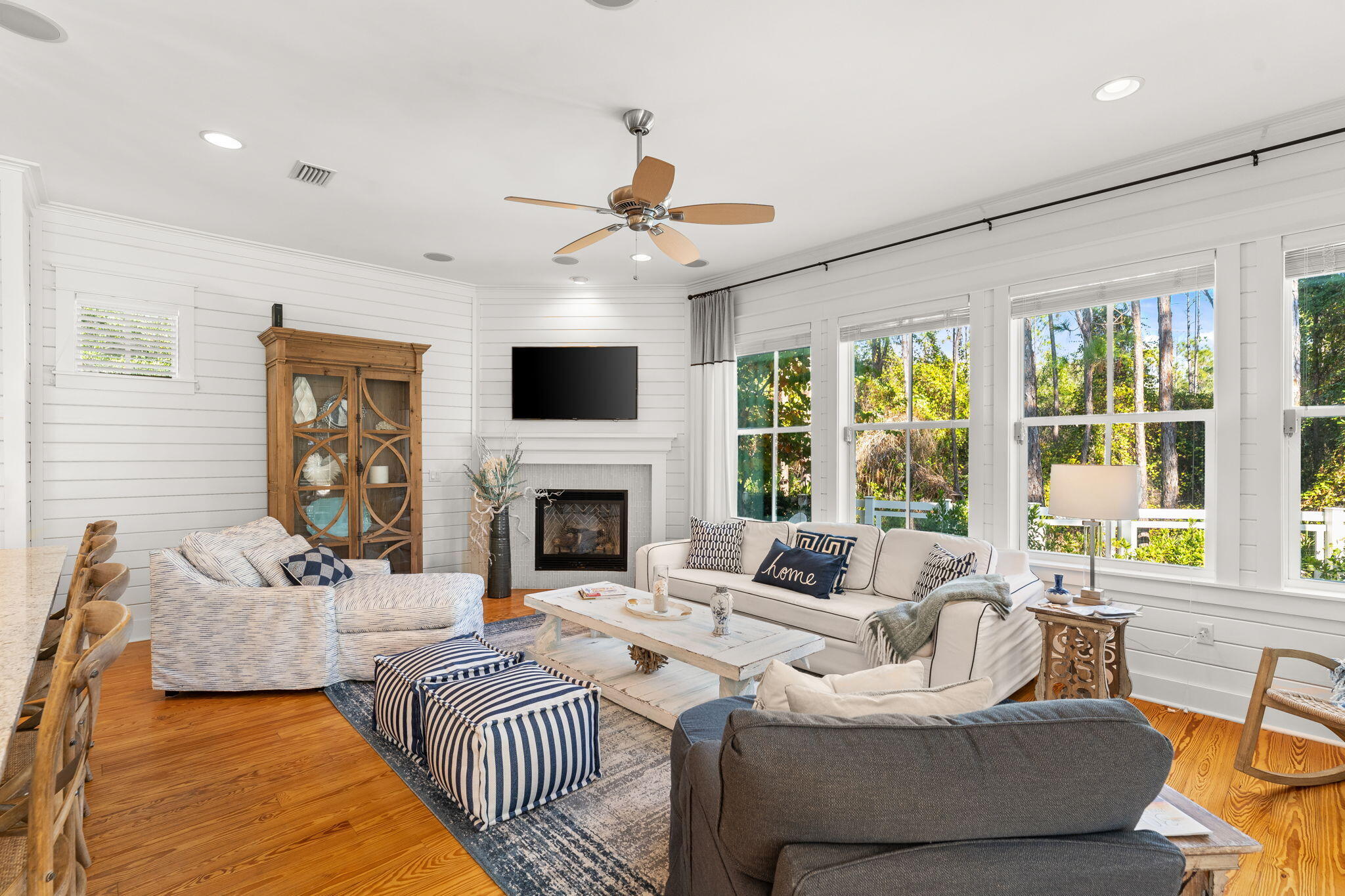 384 East Royal Fern Way Santa Rosa Beach, FL 32459 - Photo 24 of 63 a living room with furniture a fireplace and a flat screen tv