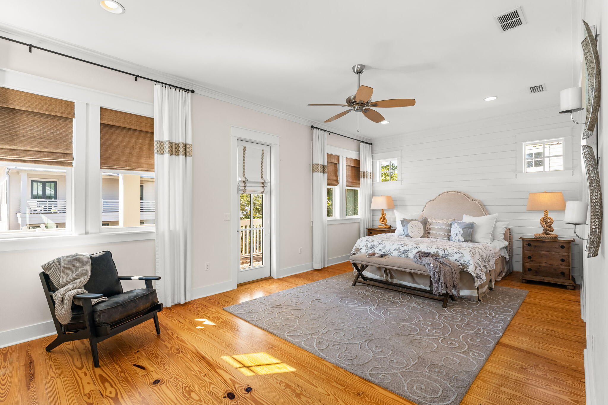 384 East Royal Fern Way Santa Rosa Beach, FL 32459 - Photo 35 of 63 a spacious bedroom with a bed and wooden floor