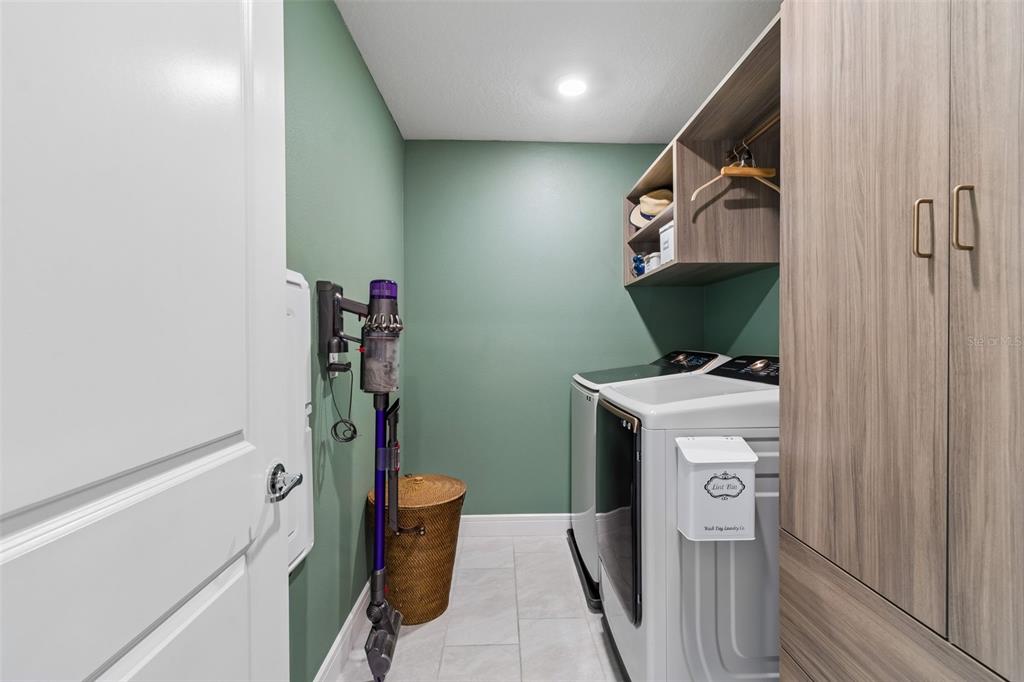 6608 Ryestone Way Wesley Chapel, FL 33545 - Photo 50 of 66 a utility room with dryer and washer