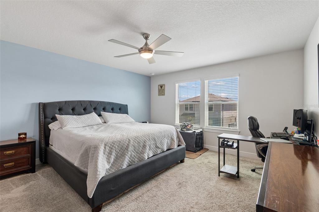 6608 Ryestone Way Wesley Chapel, FL 33545 - Photo 6 of 66 a bedroom with a bed and a window