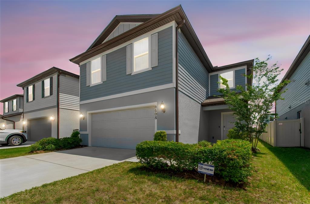 6608 Ryestone Way Wesley Chapel, FL 33545 - Photo 64 of 66 a front view of a house with a yard