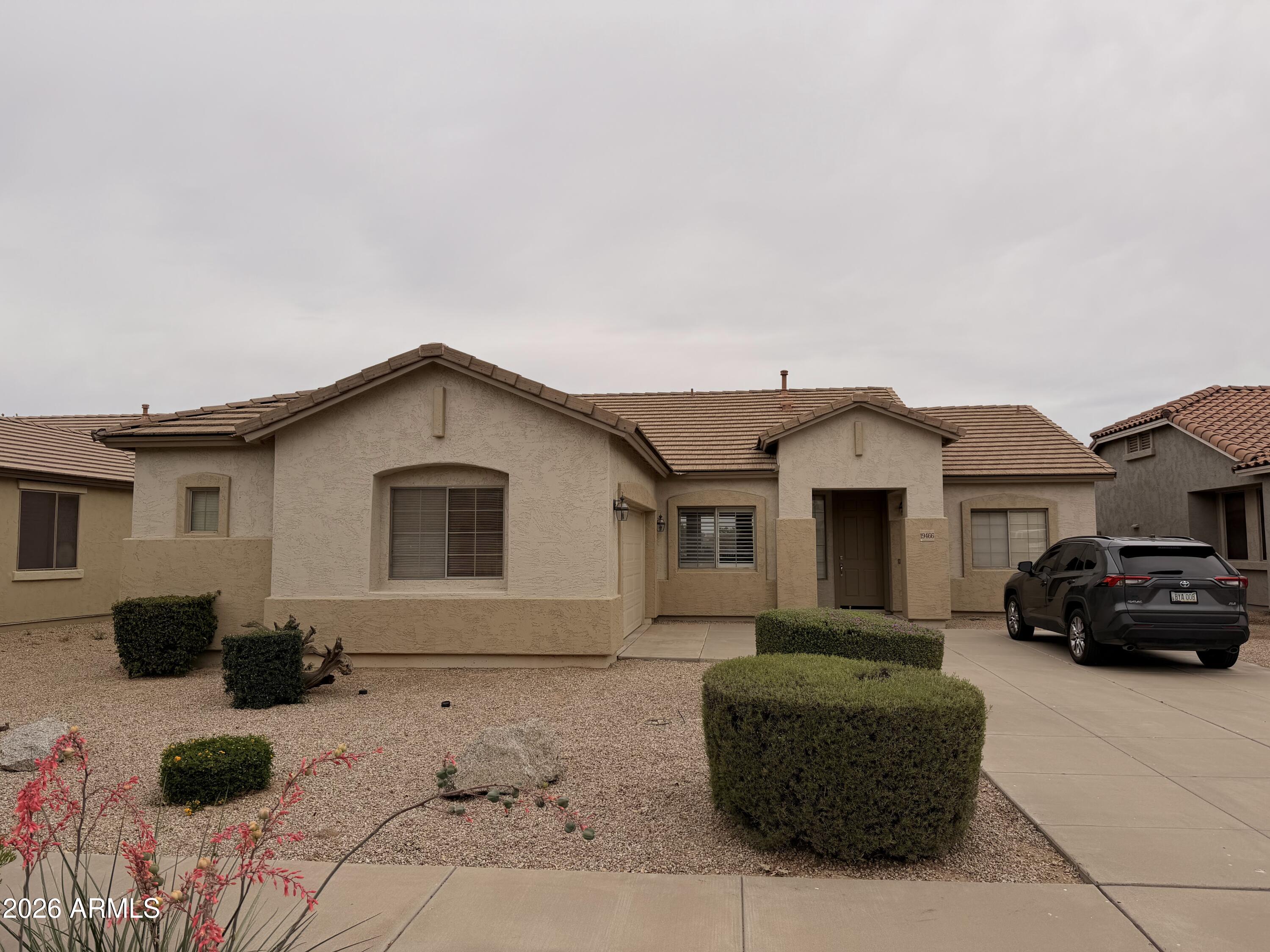 19466 East Reins Road Queen Creek, AZ 85142 - Photo 1 of 10 a front view of a house with a yard