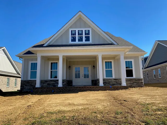 a front view of a house with yard