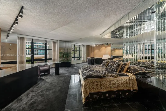 a view of a room with lots of shower and chandelier fan