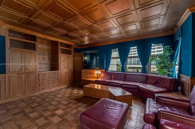 a couch sitting in a room next to a window