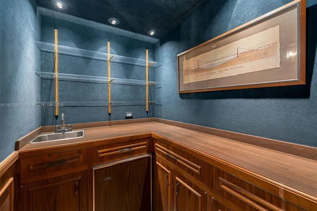 a view of a street with a cars parked and a park