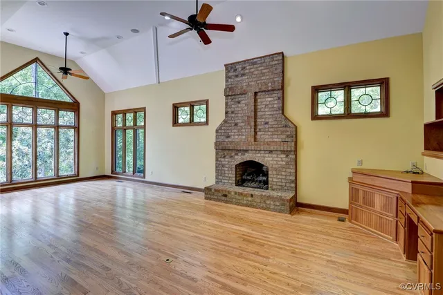 a spacious bedroom with two beds and windows