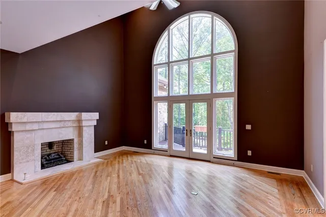 a kitchen with stainless steel appliances granite countertop a sink a counter space and wooden floors