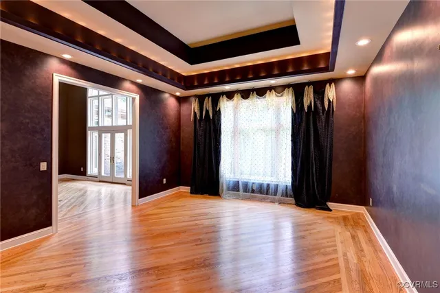 a view of a livingroom with a fireplace and windows