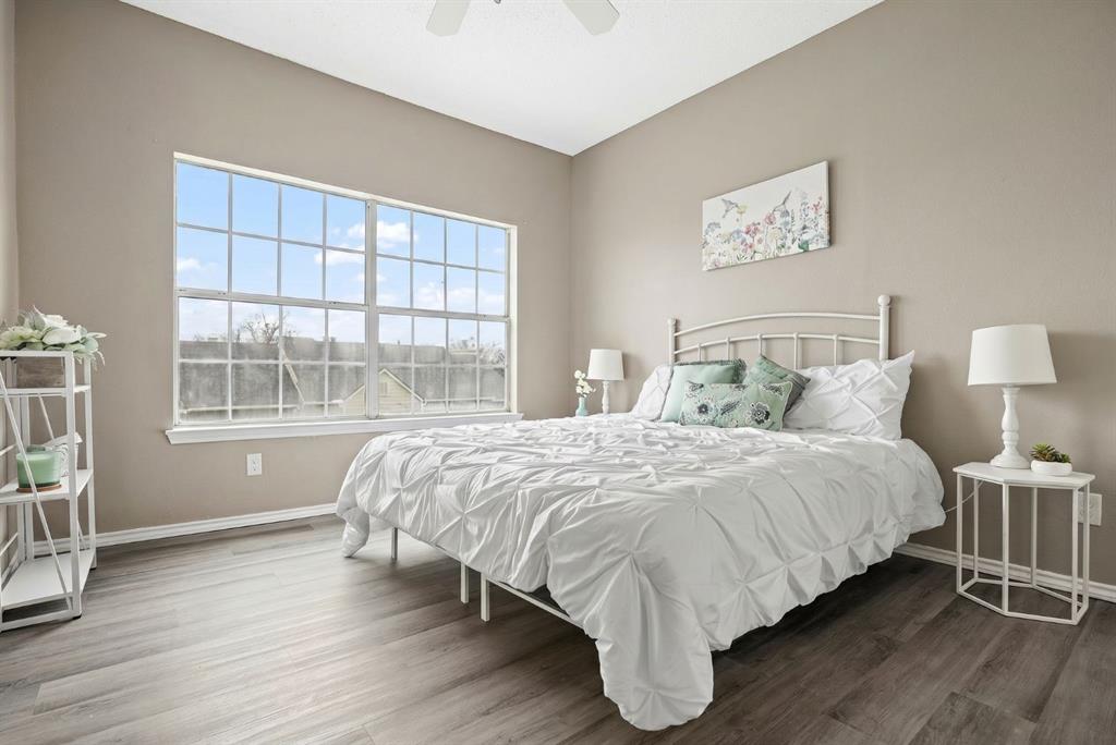 4113 Esters Road, Unit 609 Irving, TX 75038 - Photo 11 of 18 a large bed sitting in a bedroom next to a window