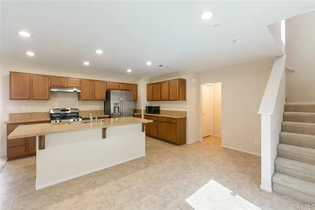 a kitchen with cabinets a sink and appliances