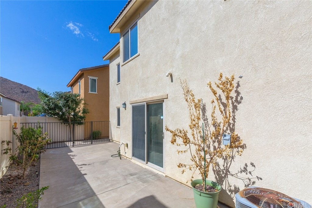 34159 Renton Drive Lake Elsinore, CA 92532 - Photo 24 of 35 a view of a house with a yard and potted plants