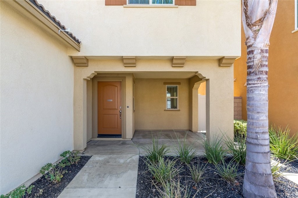 34159 Renton Drive Lake Elsinore, CA 92532 - Photo 3 of 35 a front view of a house with plants
