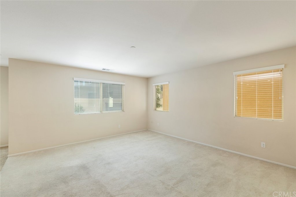 34159 Renton Drive Lake Elsinore, CA 92532 - Photo 7 of 35 an empty room with a window