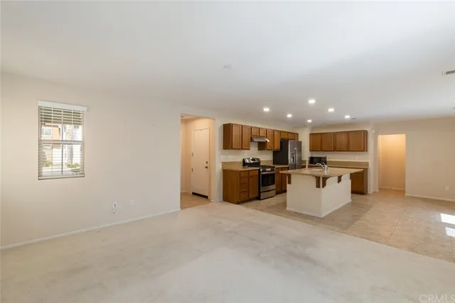 a view of a kitchen with a sink and microwave