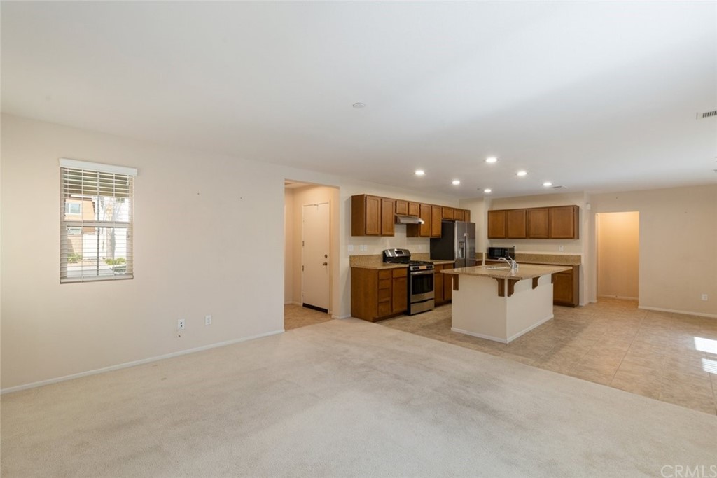 34159 Renton Drive Lake Elsinore, CA 92532 - Photo 8 of 35 a view of a kitchen with a sink and microwave