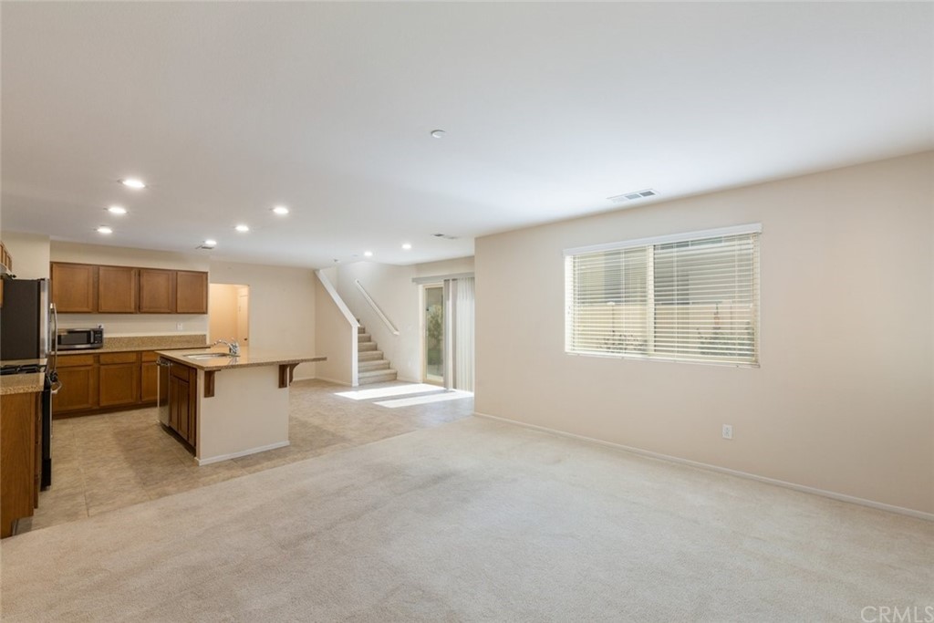 34159 Renton Drive Lake Elsinore, CA 92532 - Photo 9 of 35 a view of a kitchen with a sink and a large window