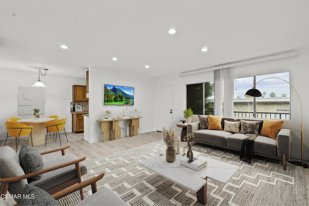 8800 Cedros Avenue, Unit 204 Panorama City, CA 91402 - Photo 2 of 11 a living room with furniture and a large window
