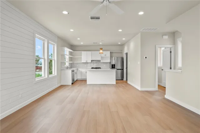 a view of a living room area and wooden floor