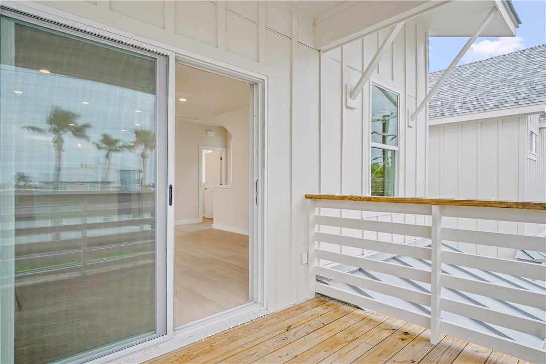 434 Oleander Street, Unit 2 Port Aransas, TX 78373 - Photo 27 of 40 a view of a hallway with wooden floor and entryway