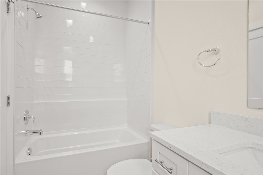 434 Oleander Street, Unit 2 Port Aransas, TX 78373 - Photo 31 of 40 a bathroom with a bathtub and a shower