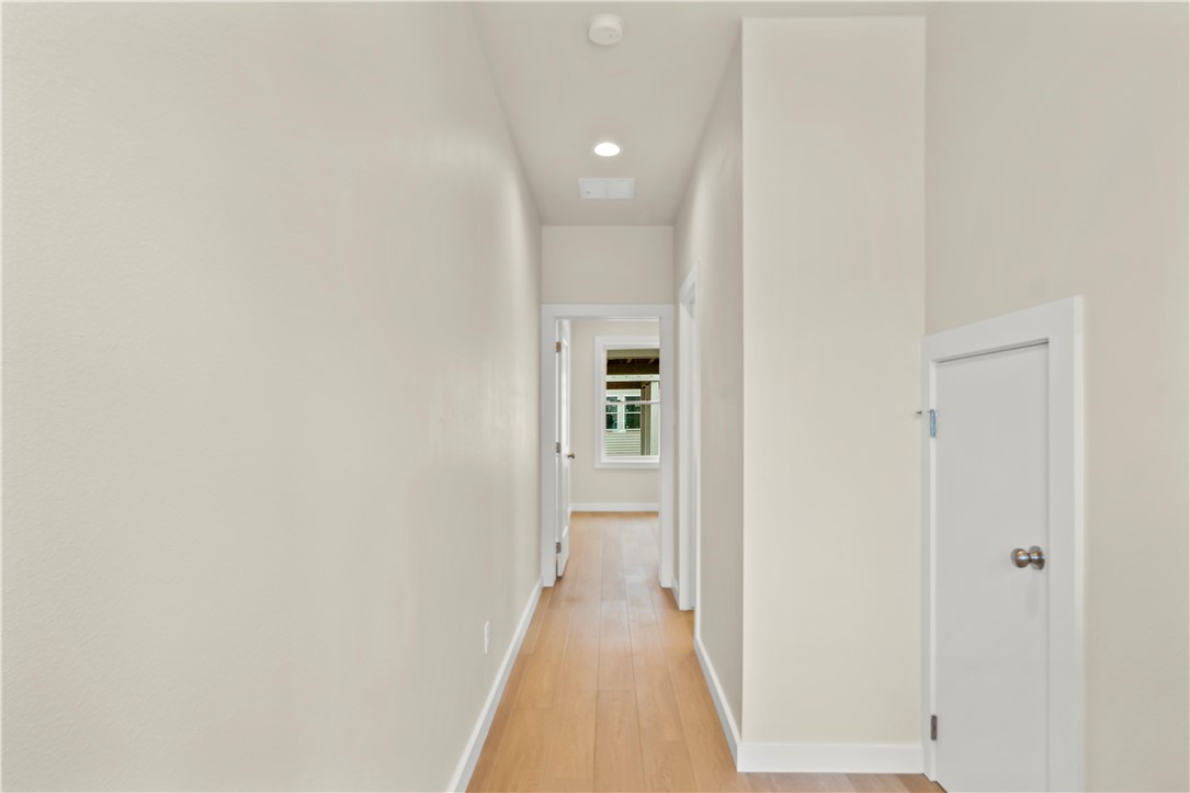 434 Oleander Street, Unit 2 Port Aransas, TX 78373 - Photo 7 of 40 a view of a hallway with wooden floor