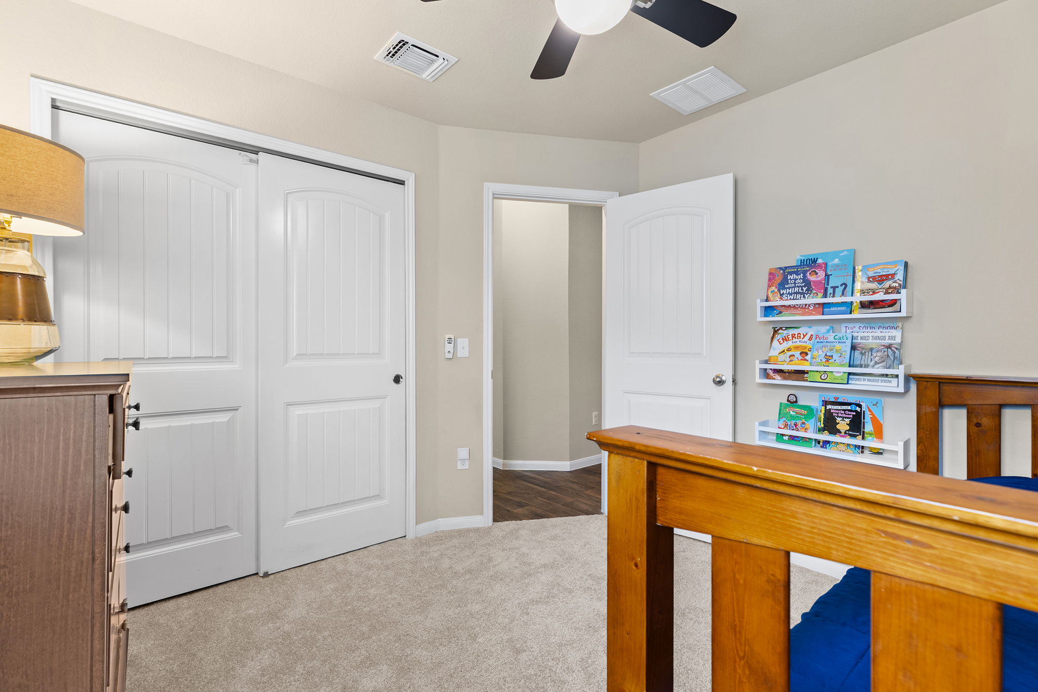 404 Cassandra Drive Hutto, TX 78634 - Photo 26 of 40 Bedroom with a closet, light colored carpet, and ceiling fan