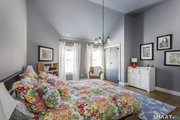 a bedroom with bed and window