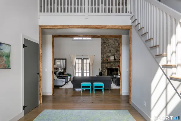 a living room with a table and chairs