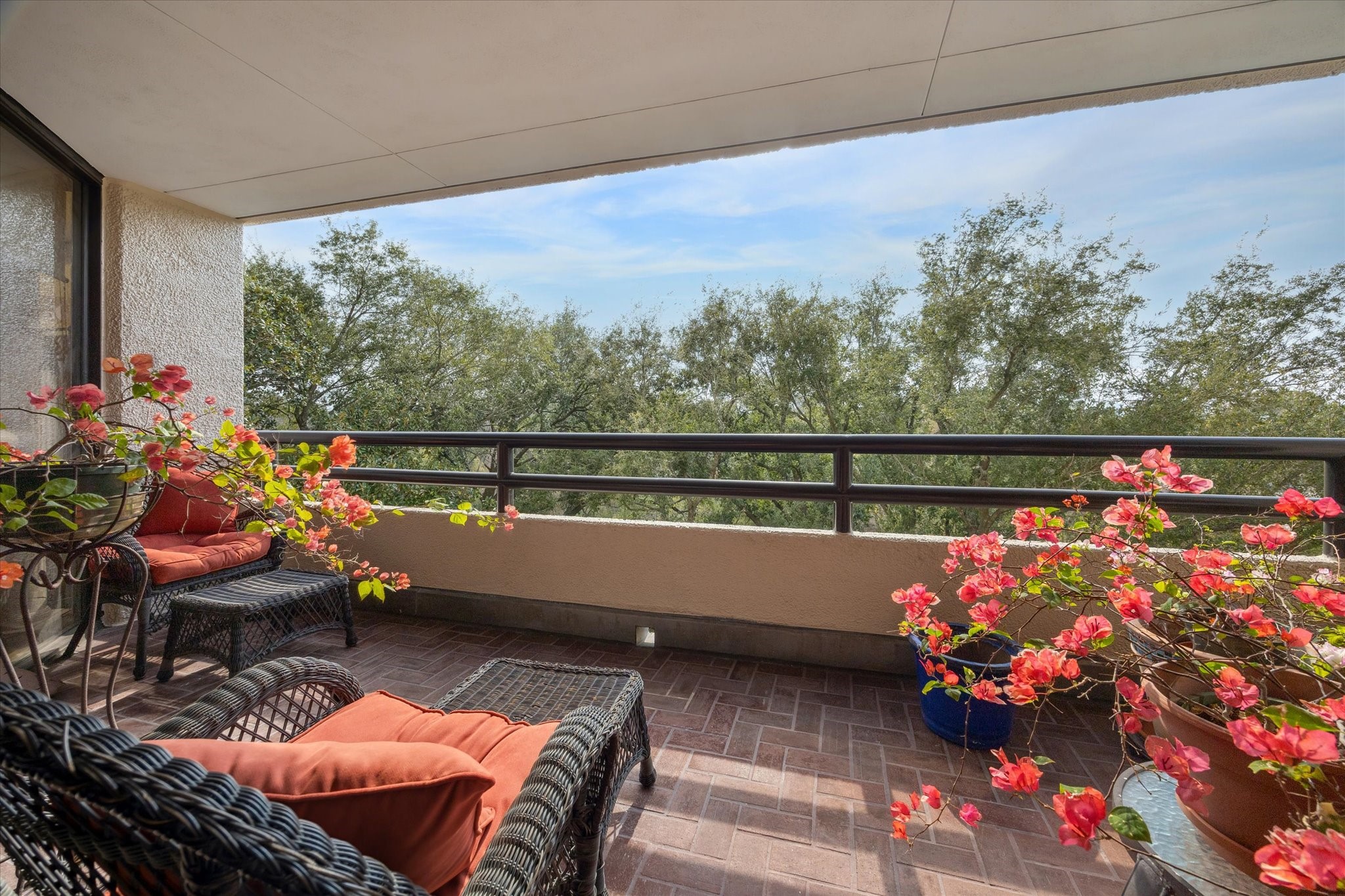 a outdoor living space with furniture and flowers