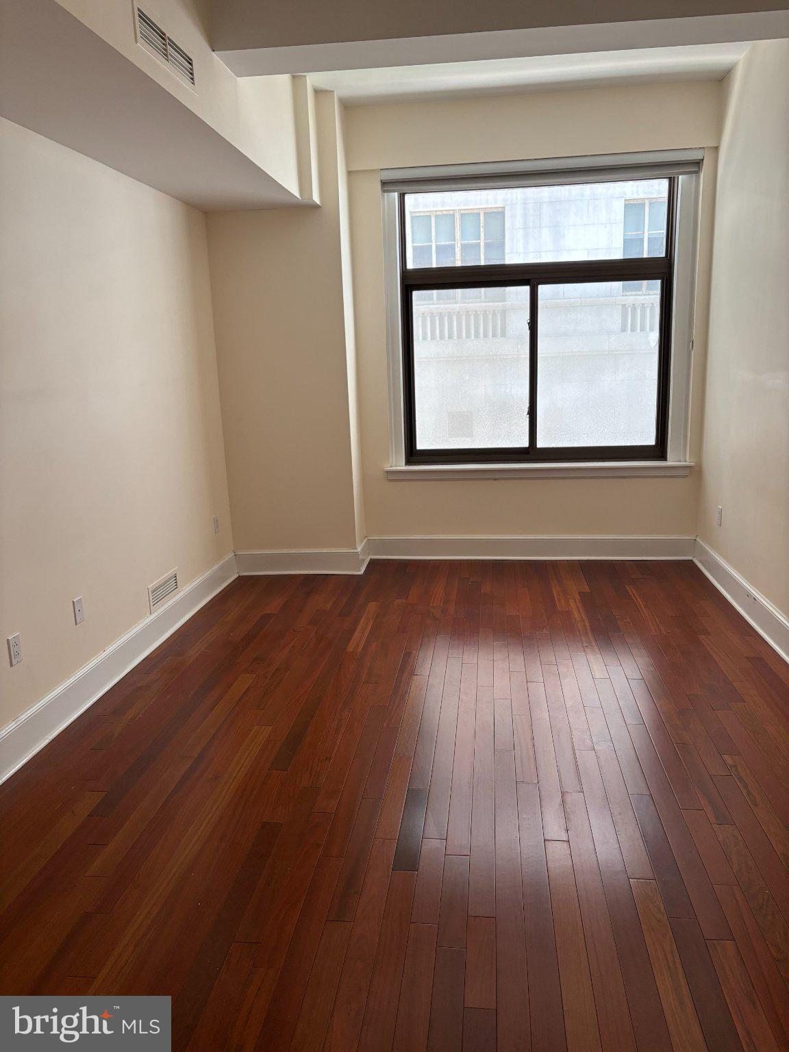 1500 Chestnut Street, Unit 4D Philadelphia, PA 19102 - Photo 21 of 26 Bright, airy space with warm wood floors.