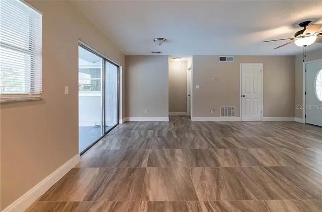 a view of a livingroom with wooden floor
