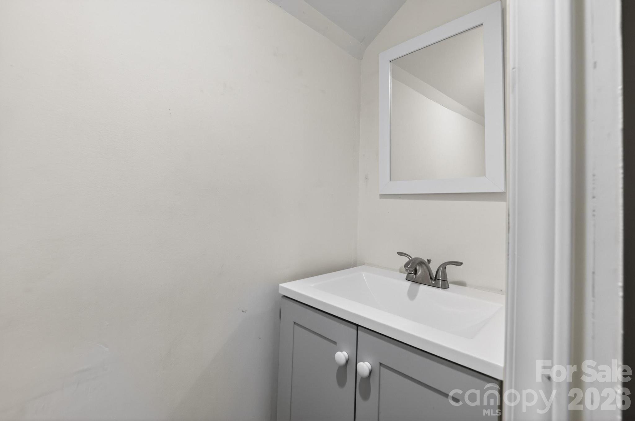 2076 Connelly Springs Road Lenoir, NC 28645 - Photo 32 of 47 a bathroom with a sink and cabinets