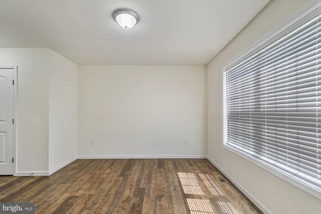 a view of an empty room and window