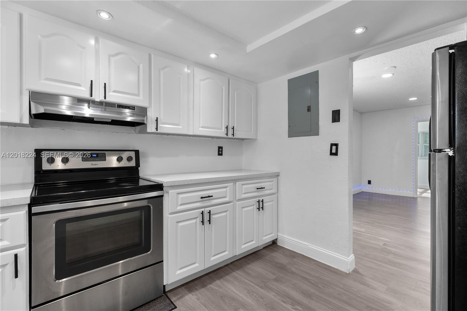 7958 Southwest 6th Street Pompano Beach, FL 33068 - Photo 20 of 57 a kitchen with stainless steel appliances granite countertop a stove a sink and a refrigerator