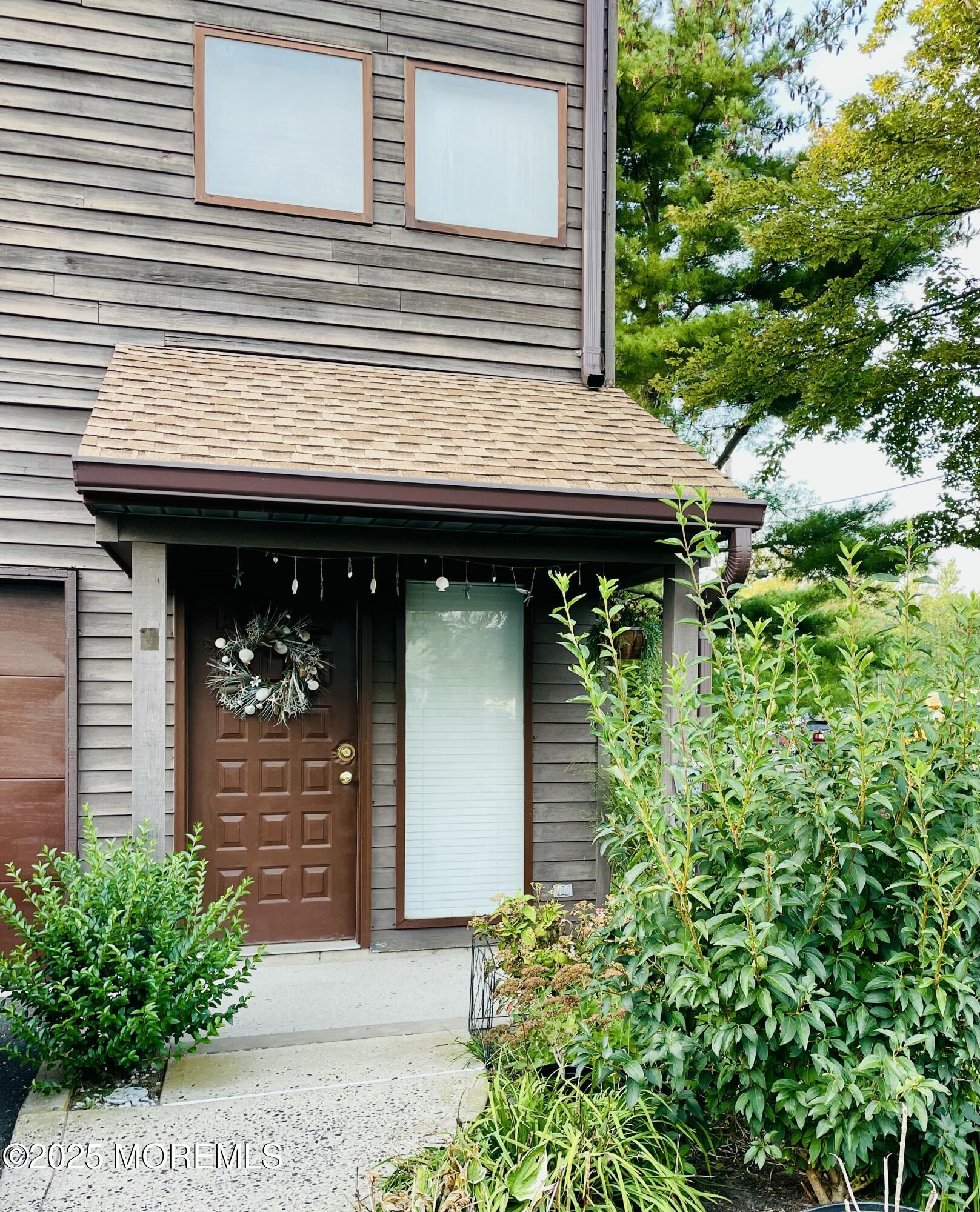 190 Spruce Street, Unit 8 Long Branch, NJ 07740 - Photo 1 of 15 a front view of a house with garden