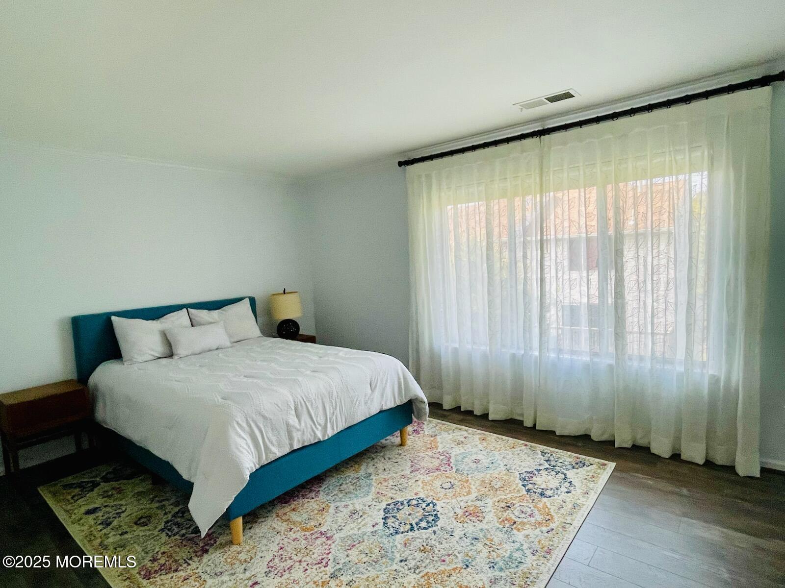 190 Spruce Street, Unit 8 Long Branch, NJ 07740 - Photo 11 of 15 a bedroom with a bed and window