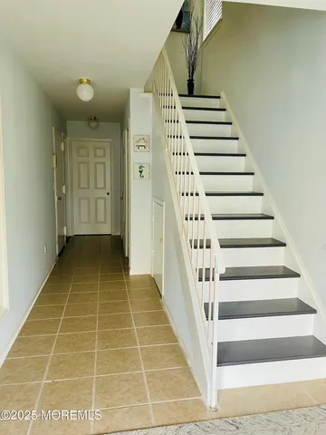 a view of an entryway with staircase