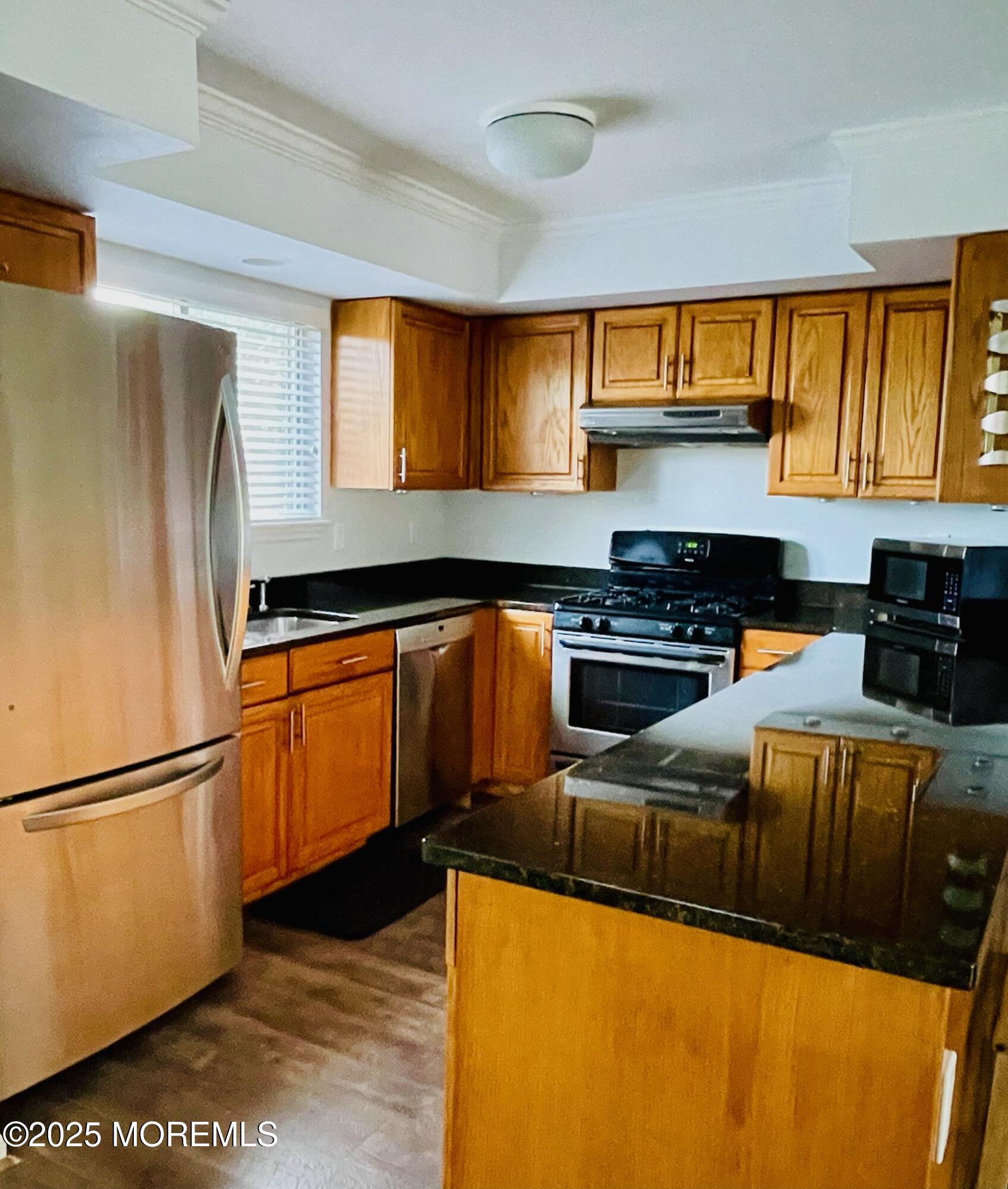 190 Spruce Street, Unit 8 Long Branch, NJ 07740 - Photo 4 of 15 a kitchen with stainless steel appliances granite countertop a refrigerator a stove and a sink