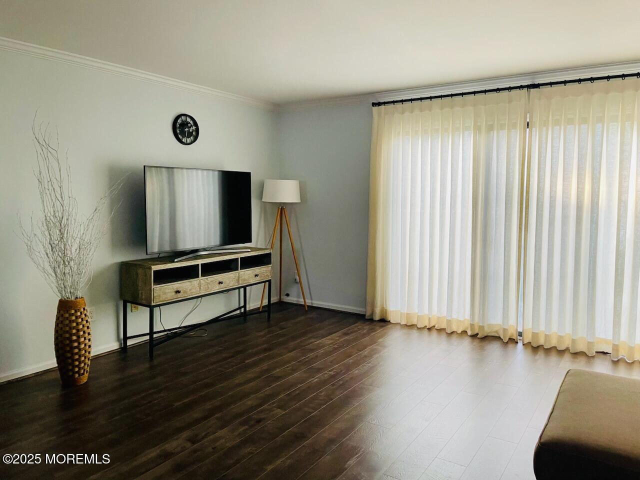 190 Spruce Street, Unit 8 Long Branch, NJ 07740 - Photo 8 of 15 an empty room with wooden floor and windows